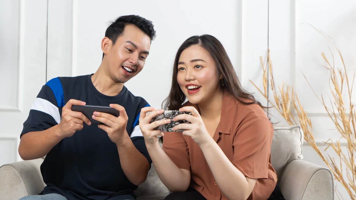 Man and woman looking at smartphones