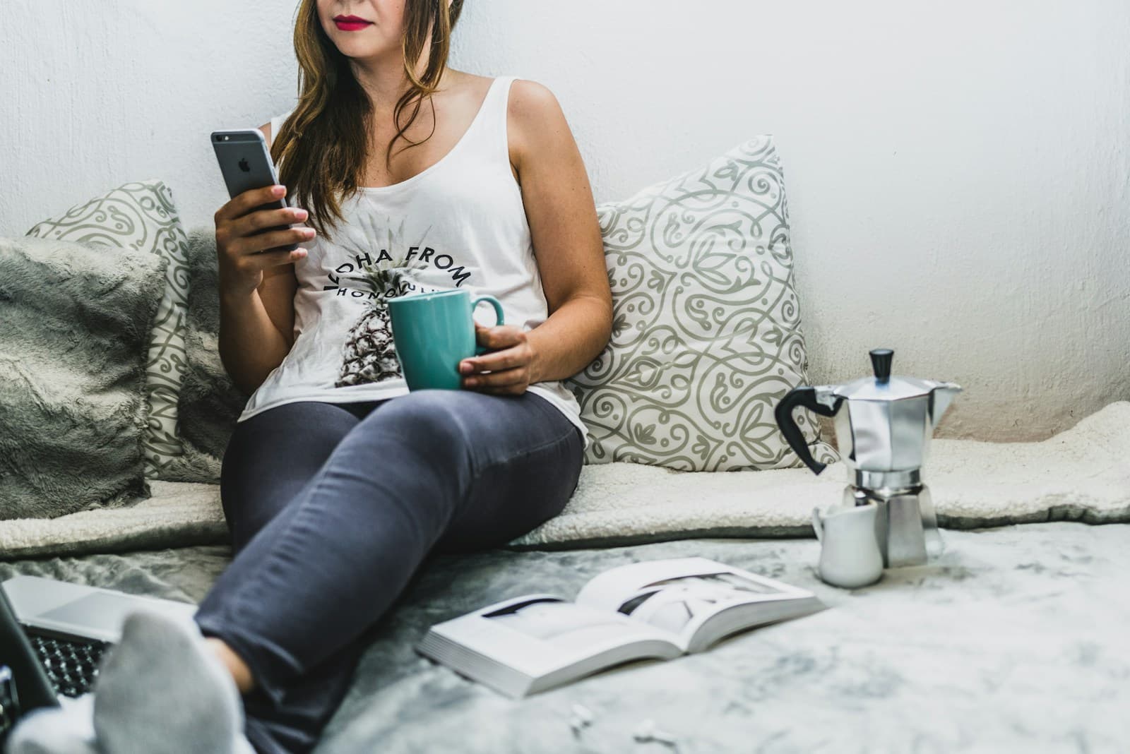 Woman relaxing on a sofa browsing her phone